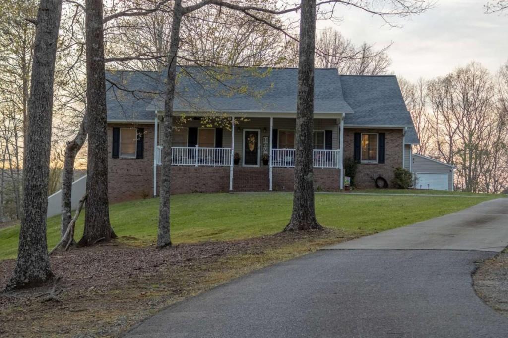 141 Chambers Mountain Road Mineral Bluff, GA 30559 - Photo 1 of 65 a front view of house with yard and green space