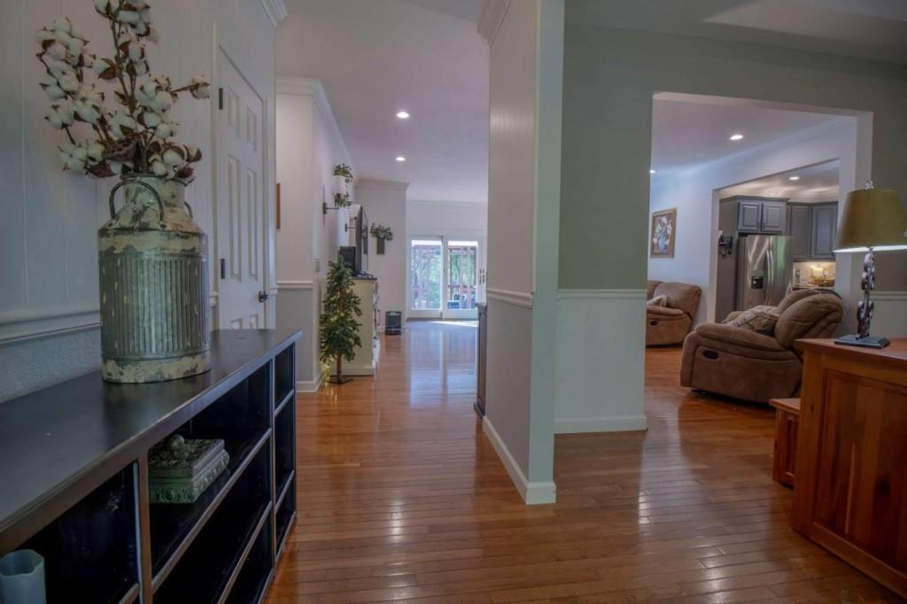 141 Chambers Mountain Road Mineral Bluff, GA 30559 - Photo 43 of 65 a hallway with wooden floor and couches