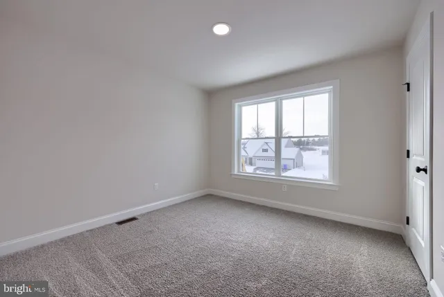 a view of a hallway with closet area