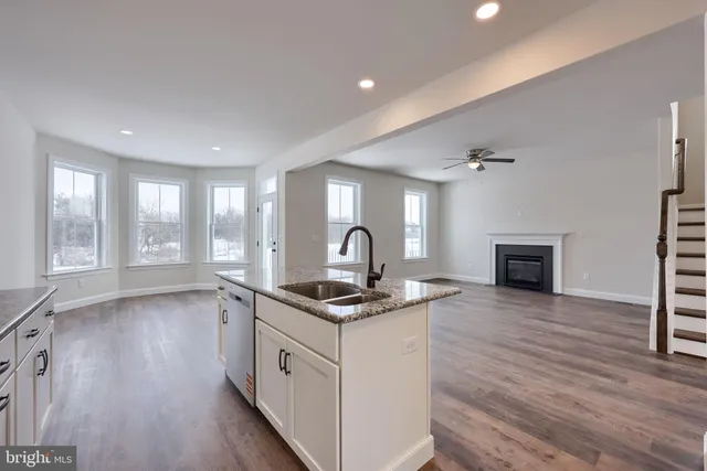 a kitchen with a stove and a sink