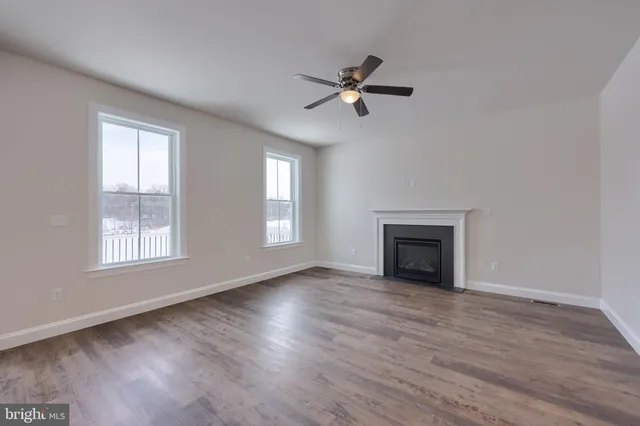 a view of kitchen with sink and wooden floor