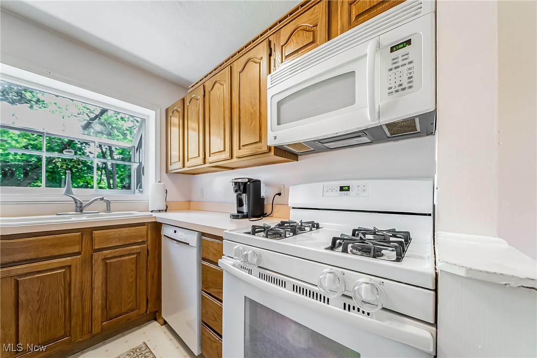 1607 Richmond Road Cleveland, OH 44124 - Photo 7 of 32 Kitchen featuring light tile patterned floors and white appliances