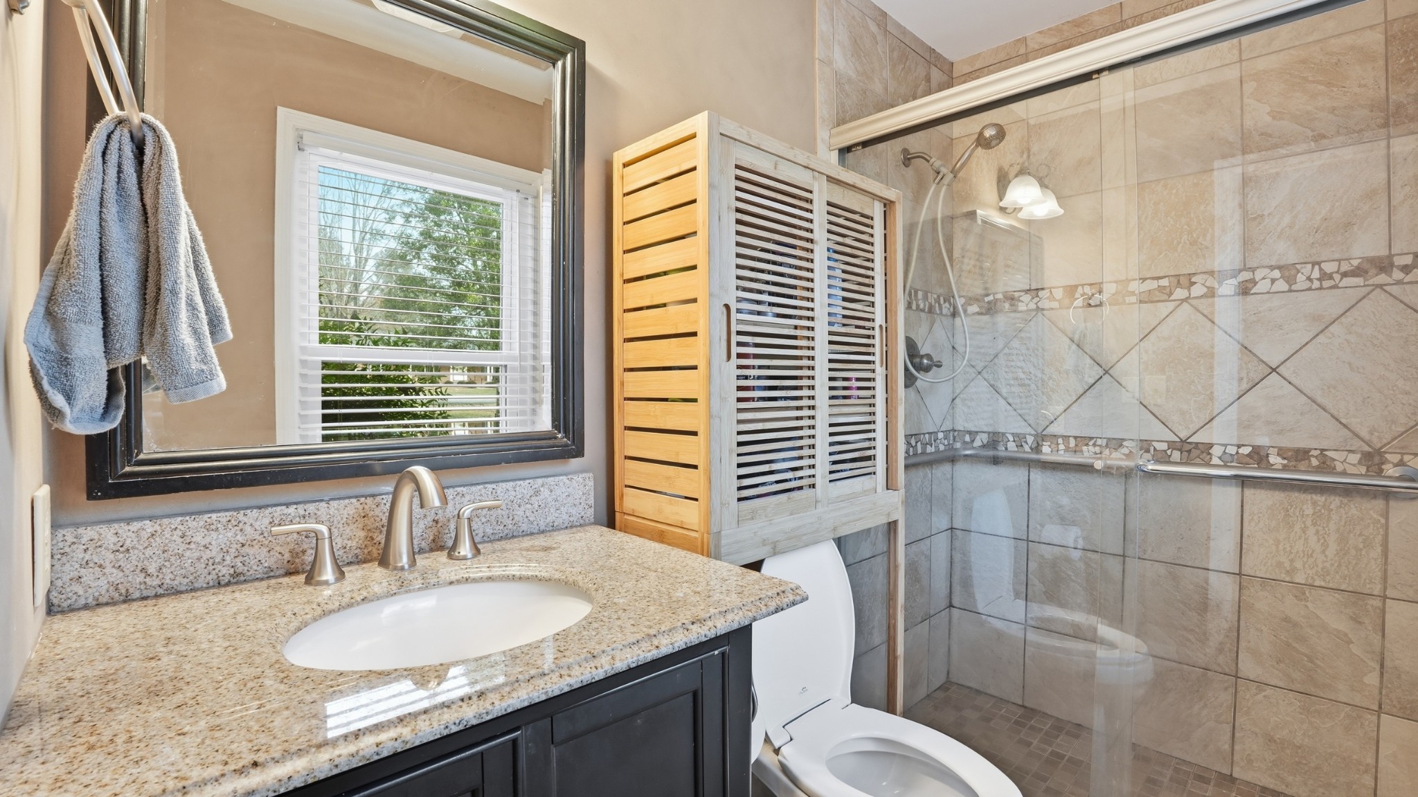 270 Wood Bluff Road Winchester, TN 37398 - Photo 33 of 69 a bathroom with a granite countertop sink toilet and shower