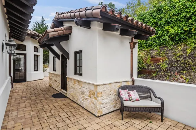a white house with a table and chairs