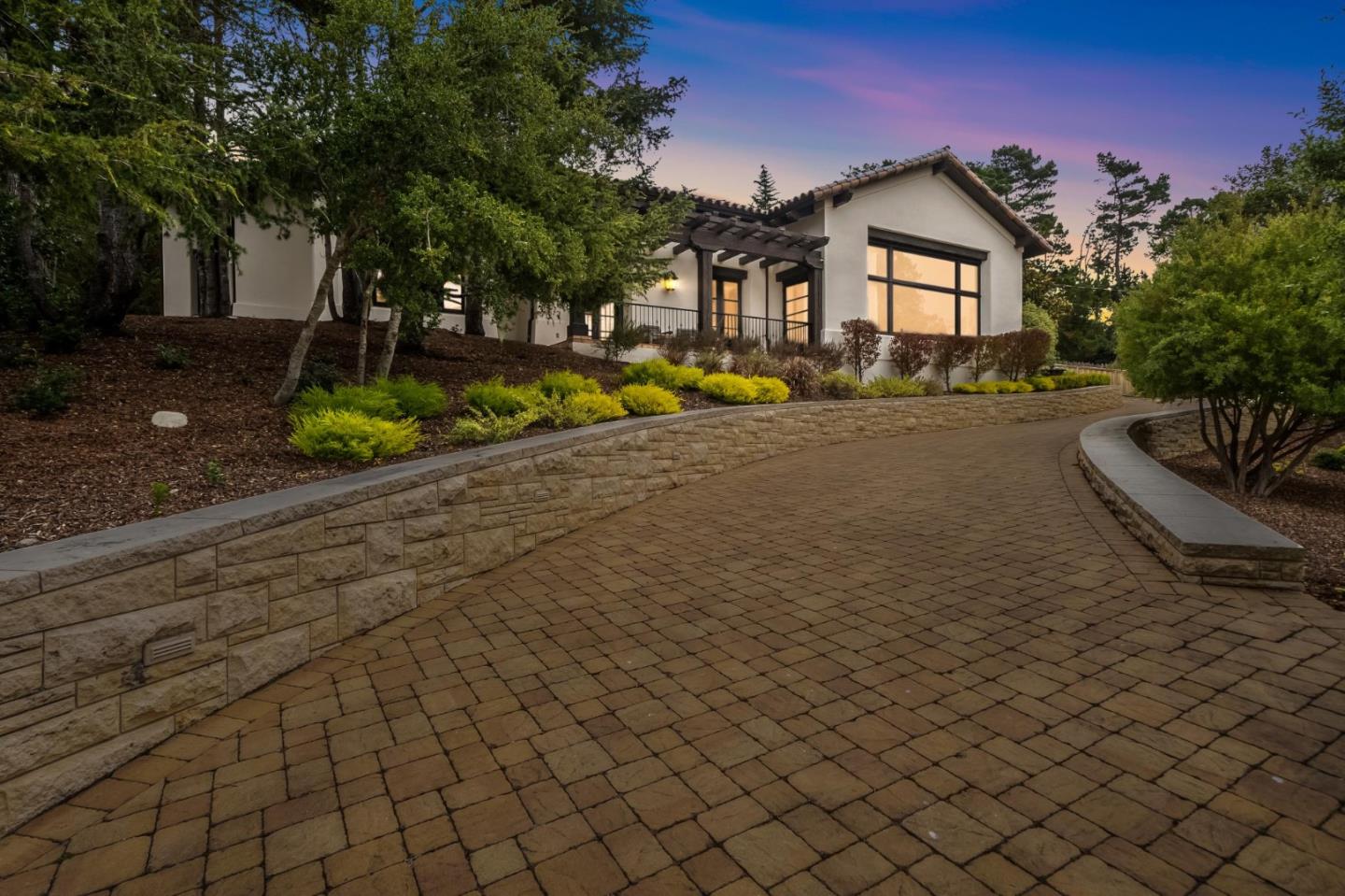 1425 Oleada Road Pebble Beach, CA 93953 - Photo 37 of 39 a front view of a house with a yard