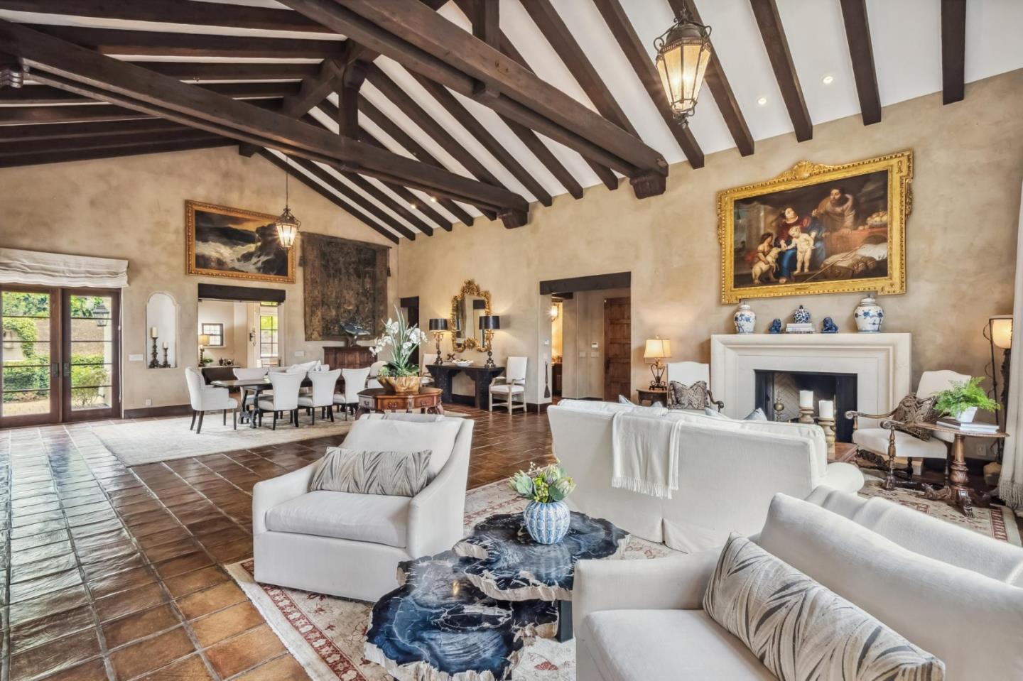 1425 Oleada Road Pebble Beach, CA 93953 - Photo 5 of 39 a living room with furniture a fireplace and a table