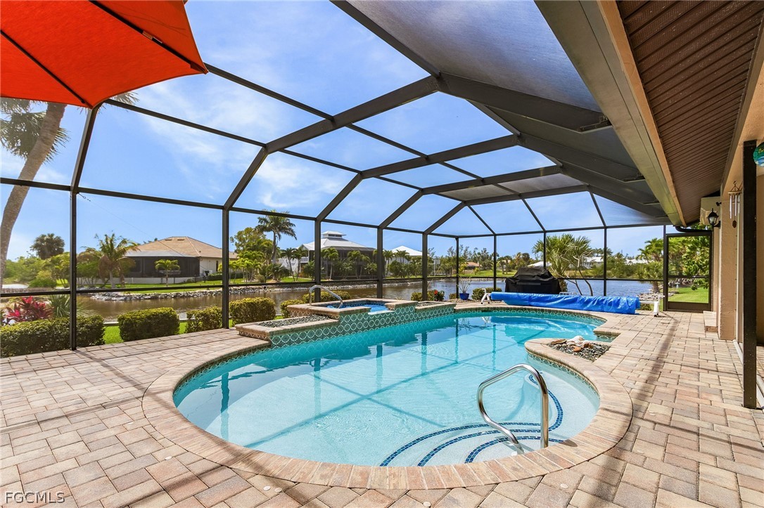 7747 Grande Pine Road Bokeelia, FL 33922 - Photo 35 of 45 a view of a swimming pool with a patio