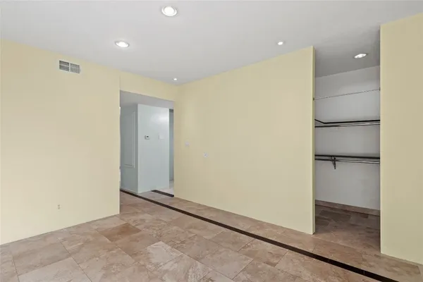 a view of a room with racks on the wall