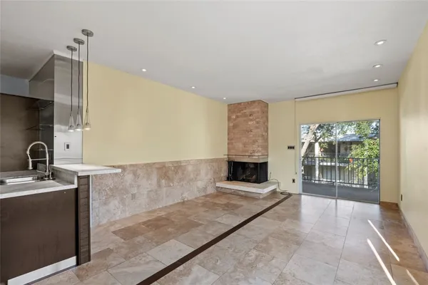 an empty room with a fireplace