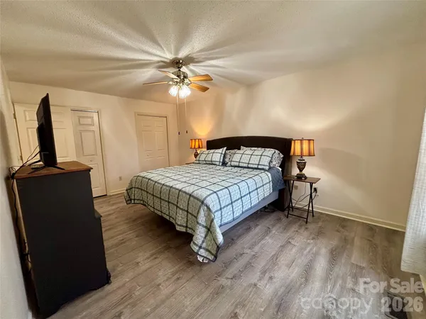 a bedroom with a bed furniture and a window