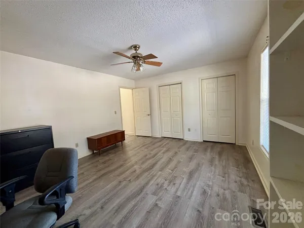 a view of livingroom with workspace and a couch