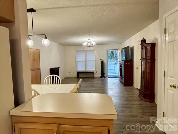 a view of kitchen with furniture and wooden floor