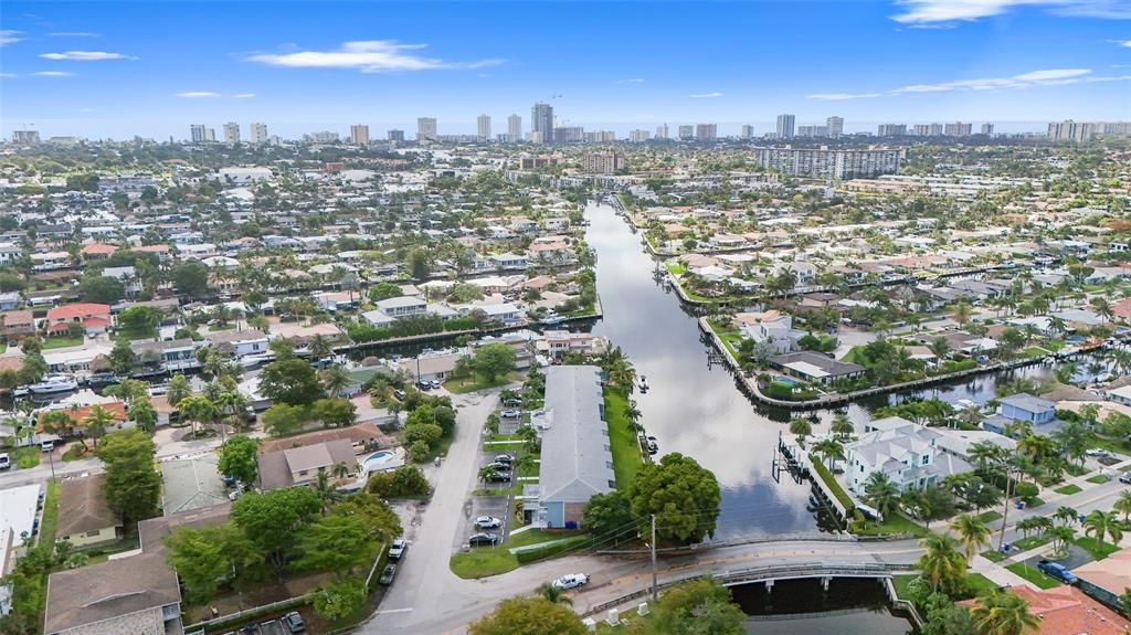 1100 Pine Drive, Unit 107 Pompano Beach, FL 33060 - Photo 38 of 40 an aerial view of residential building and lake