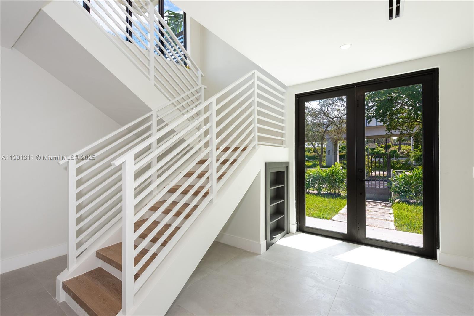 101 Southwest 25th Road Miami, FL 33129 - Photo 13 of 35 a view of a bedroom with balcony and stairs