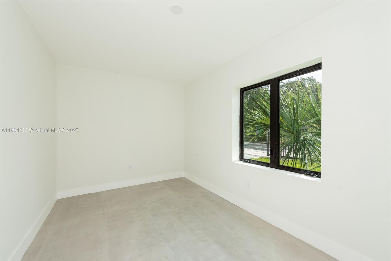 101 Southwest 25th Road Miami, FL 33129 - Photo 34 of 35 an empty room with a window