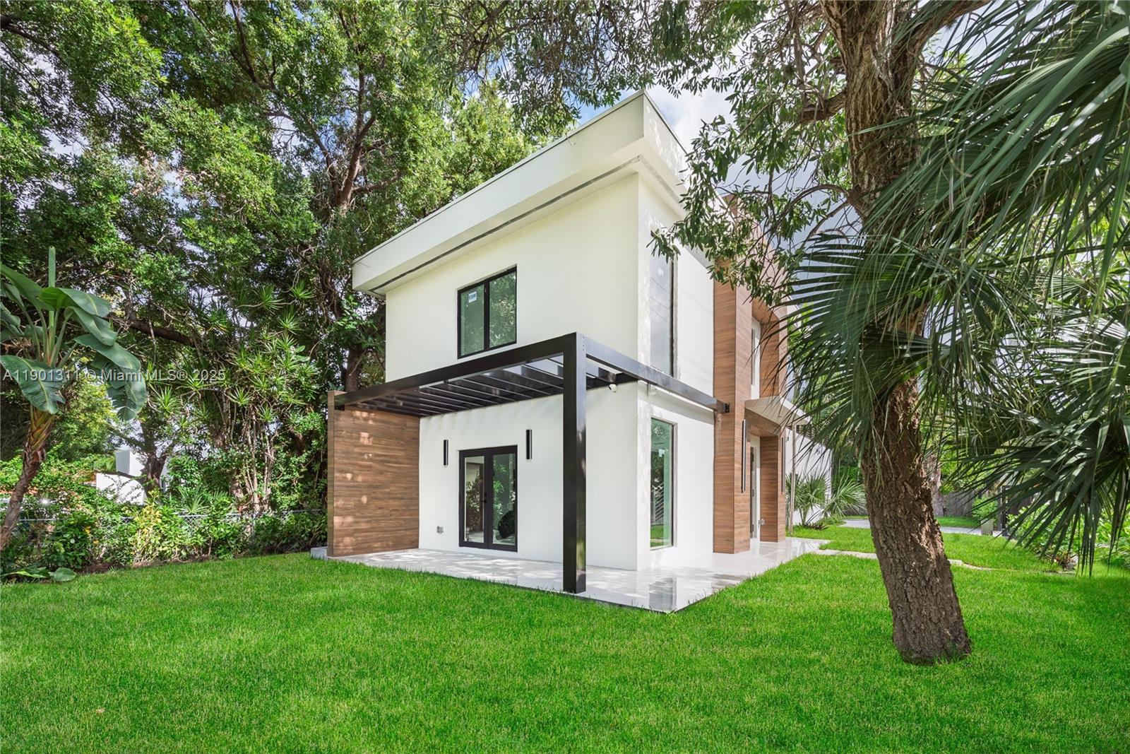 101 Southwest 25th Road Miami, FL 33129 - Photo 4 of 35 a view of a house with a yard