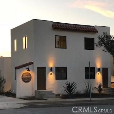 375 Termino Avenue, Unit A Long Beach, CA 90814 - Photo 12 of 13 a front view of a house with garden