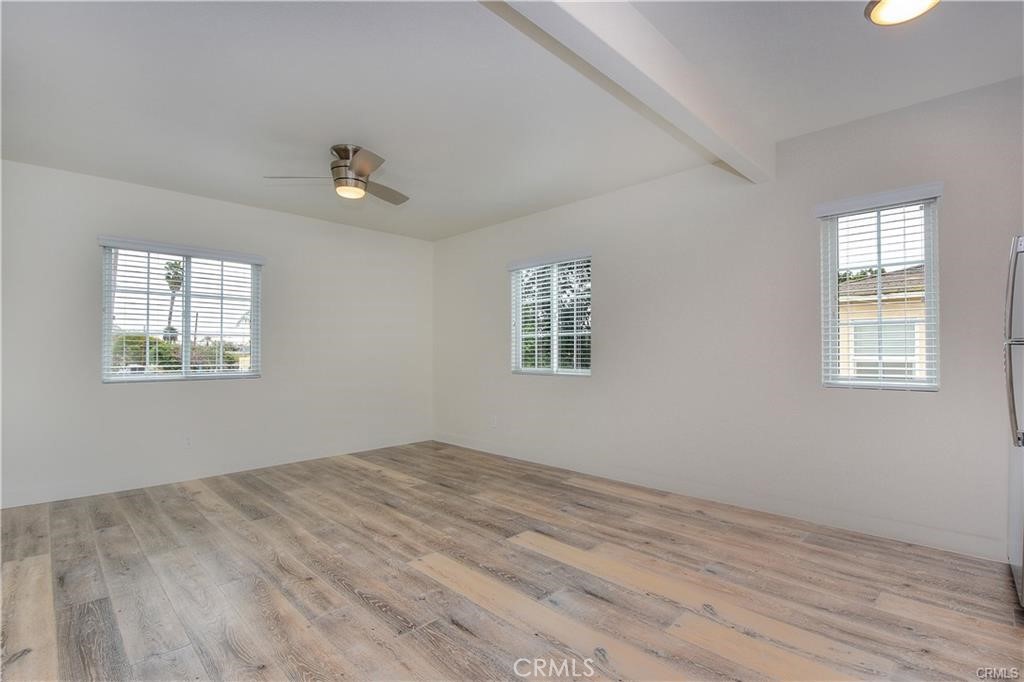 375 Termino Avenue, Unit A Long Beach, CA 90814 - Photo 2 of 13 a view of empty room with wooden floor and fan