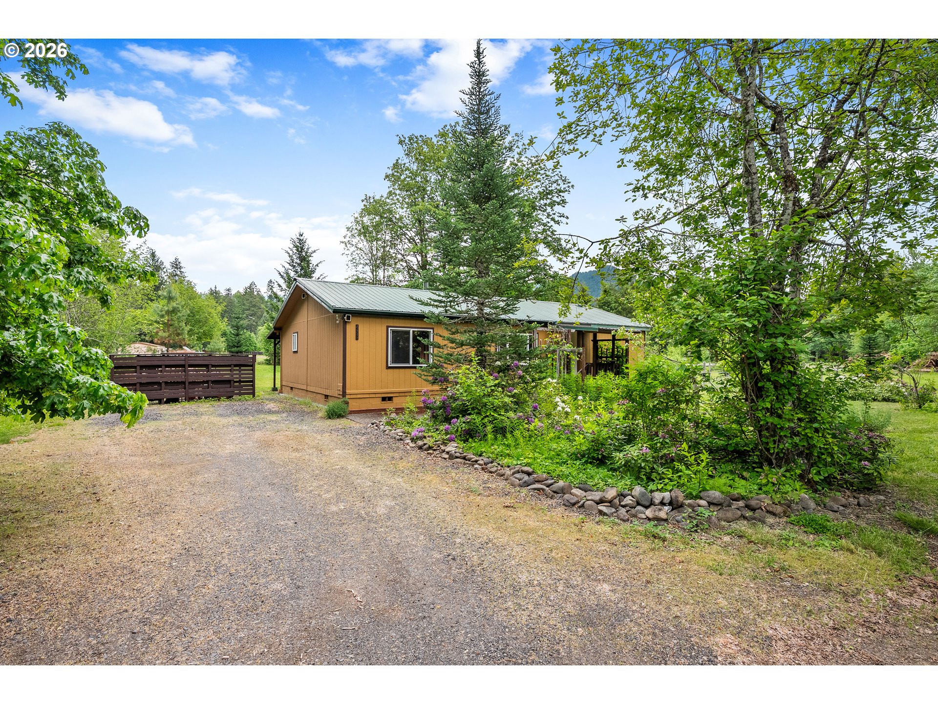 451 Cannavinna Road Carson, WA 98610 - Photo 33 of 33 a view of a house with backyard and garden