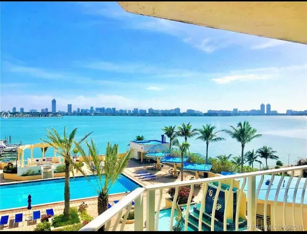 a kitchen with a sink a stove and cabinets