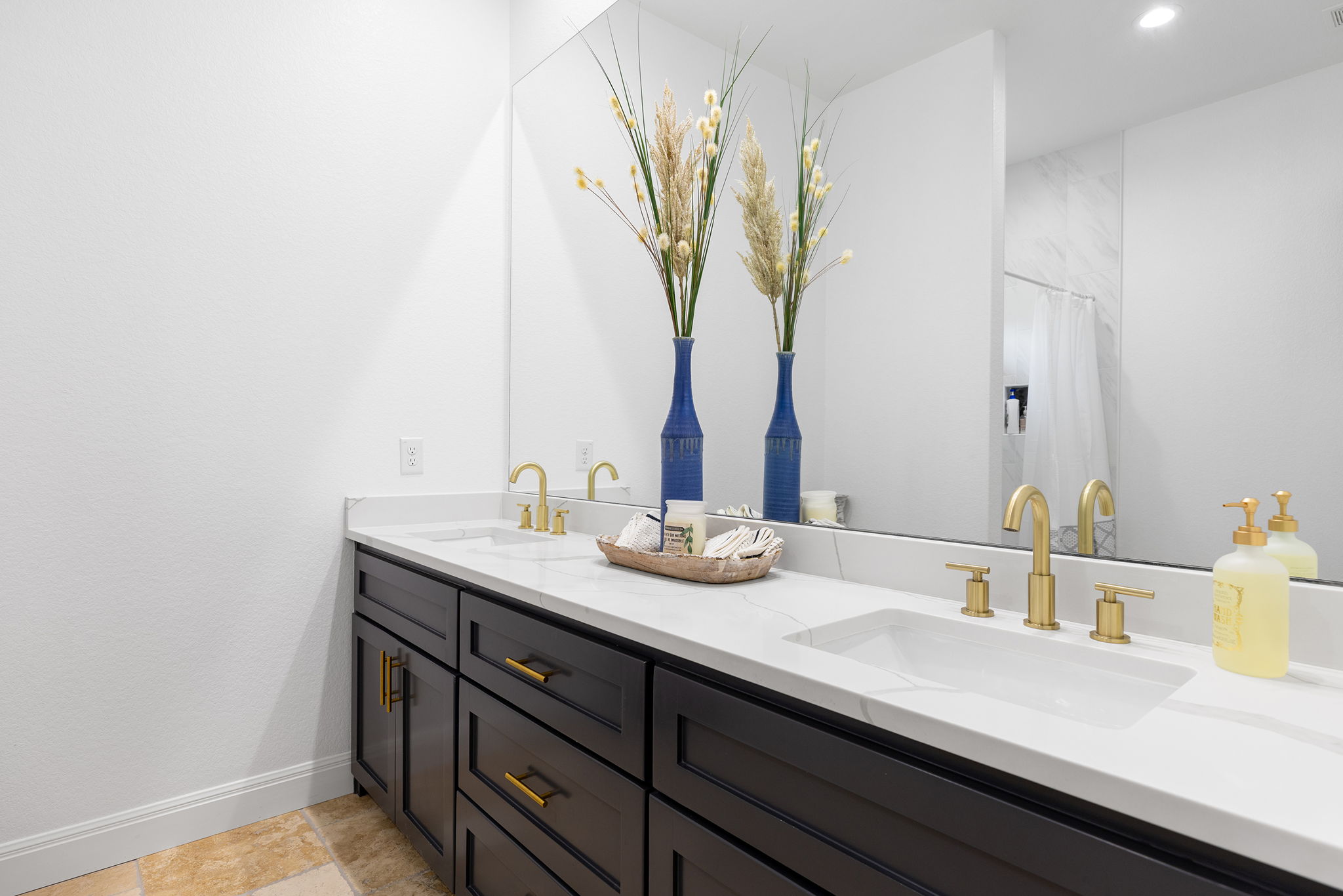 153 Fawn Hollow Elgin, TX 78621 - Photo 30 of 40 a bathroom with a granite countertop sink a mirror and vanity