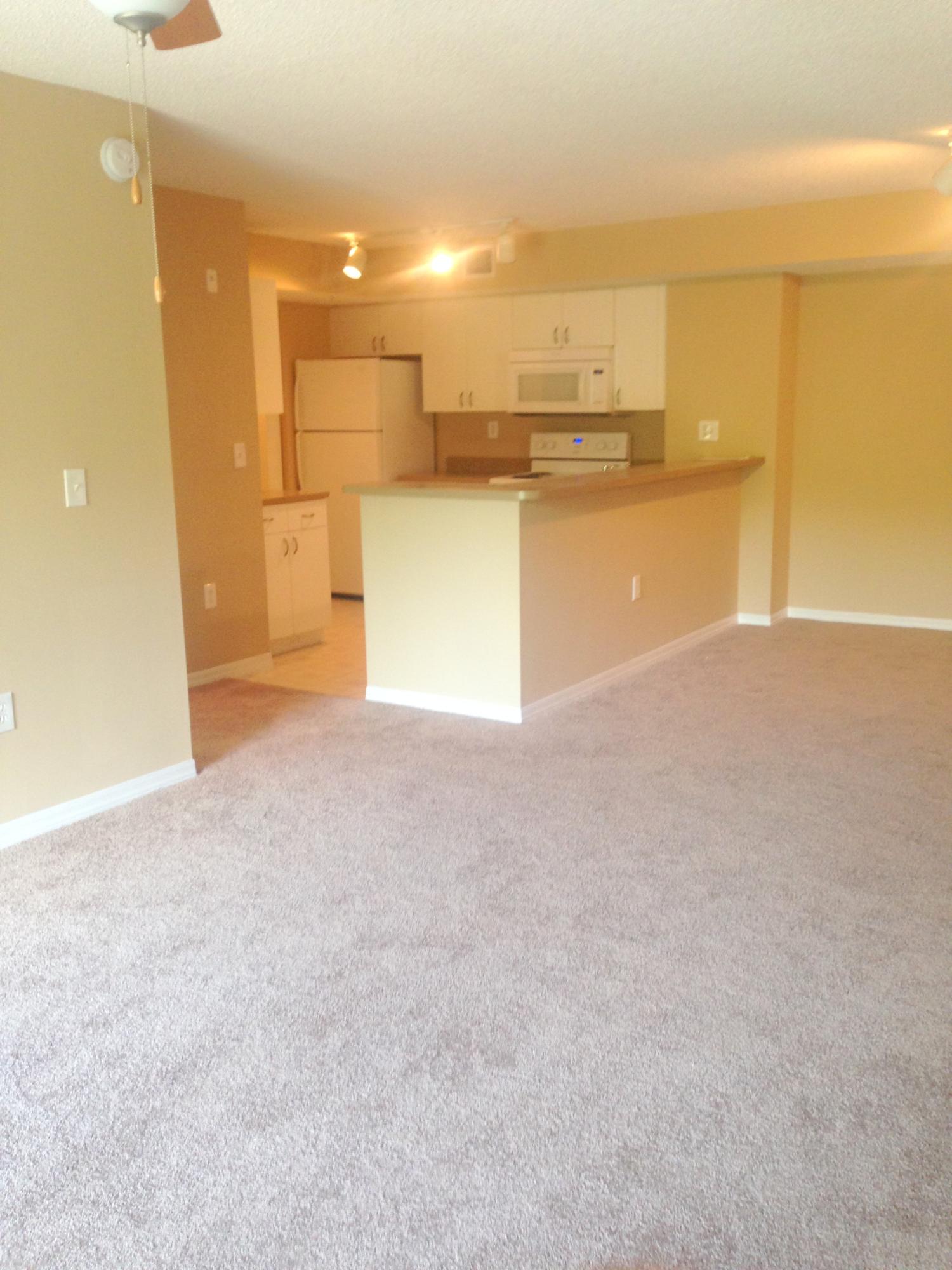3854 Lyons Road, Unit 2085 Coconut Creek, FL 33073 - Photo 1 of 13 Living Room & Kitchen