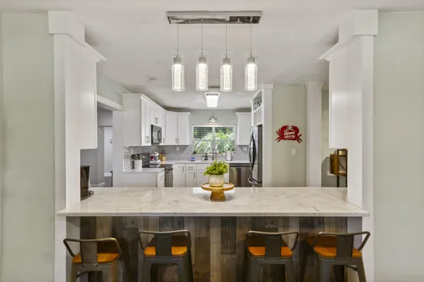 a kitchen with cabinets and window