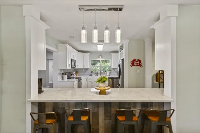 a kitchen with cabinets and window