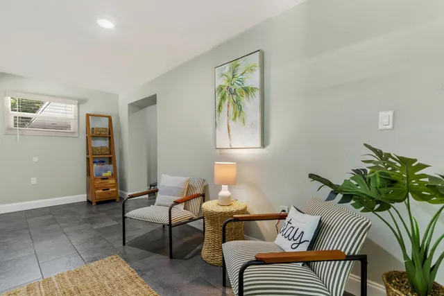 a living room with furniture and a table