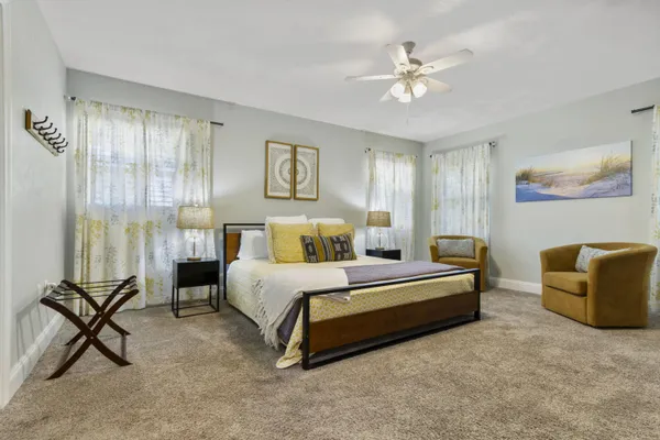 a bedroom with bed and window