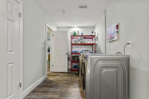 a bedroom with a large bed and a dresser