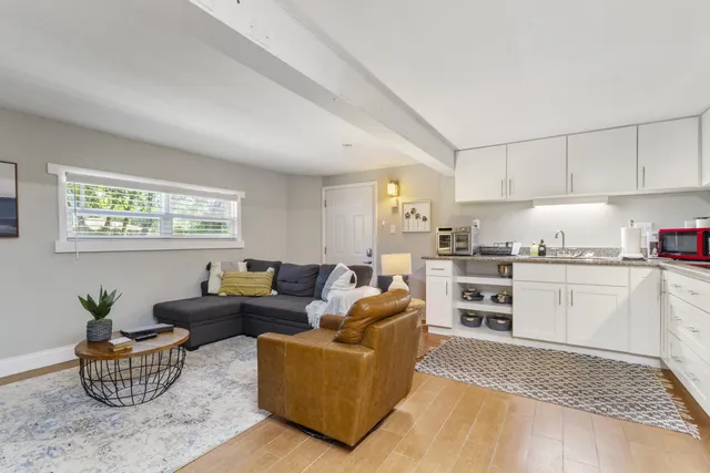 a living room with furniture and a table