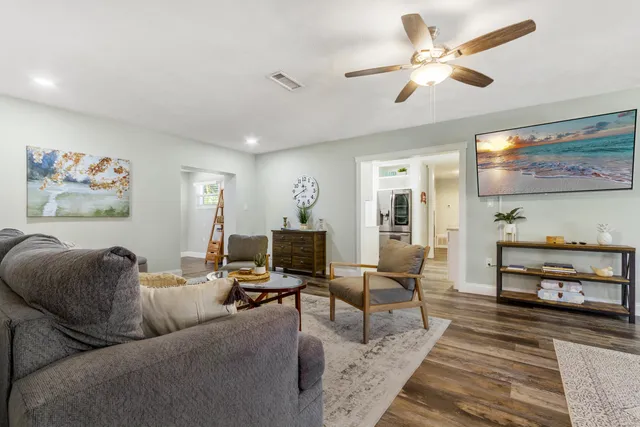 a work room with furniture and wooden floor