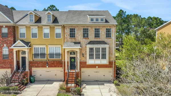a view of a brick house with a outdoor space