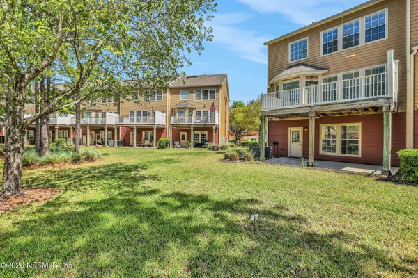 a front view of a building with a garden