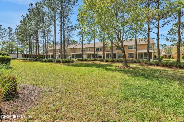 a view of entryway with wooden floor and stairs
