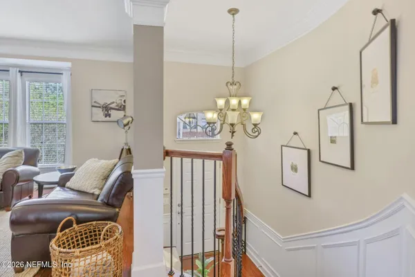 a living room with furniture a fireplace and a table