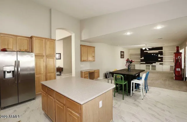 a kitchen with a table and chairs in it