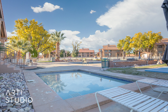 860 South Village Road, Unit A6 St. George, UT 84770 - Photo 20 of 41 Community pool featuring a residential view and a patio