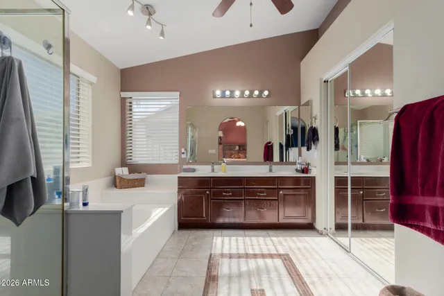 a large bathroom with a large tub and sink