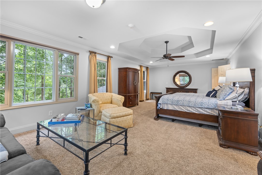 106 Red Maple Way Clemson, SC 29631 - Photo 21 of 49 An elegant tray ceiling and large windows define this comfortable primary bedroom suite.