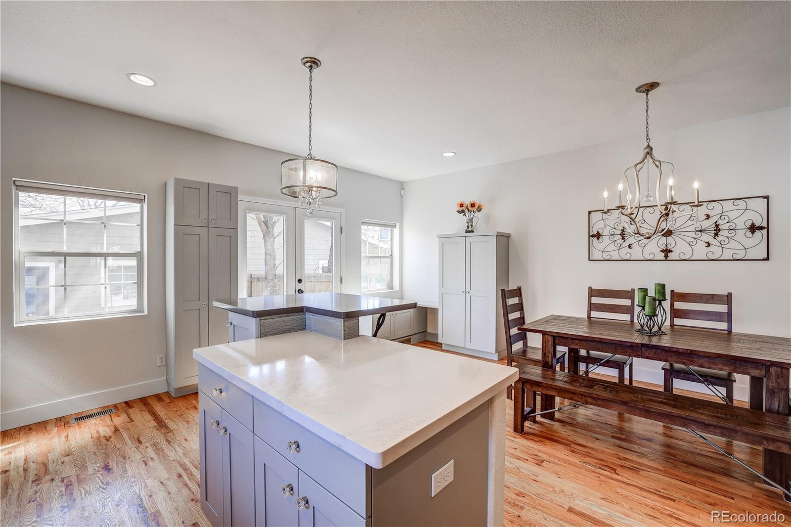 4530 Quitman Street Denver, CO 80212 - Photo 13 of 40 a view of a kitchen counter top space with stainless steel appliances granite countertop living room