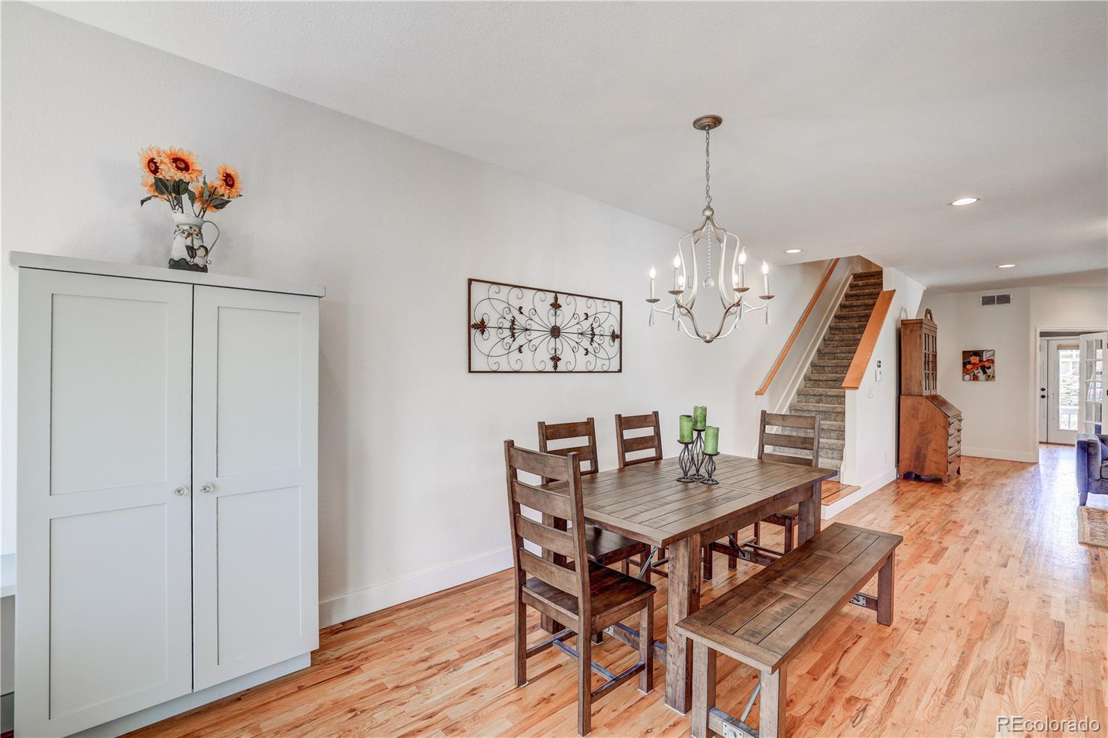 4530 Quitman Street Denver, CO 80212 - Photo 16 of 40 a view of a dining room with furniture and wooden floor