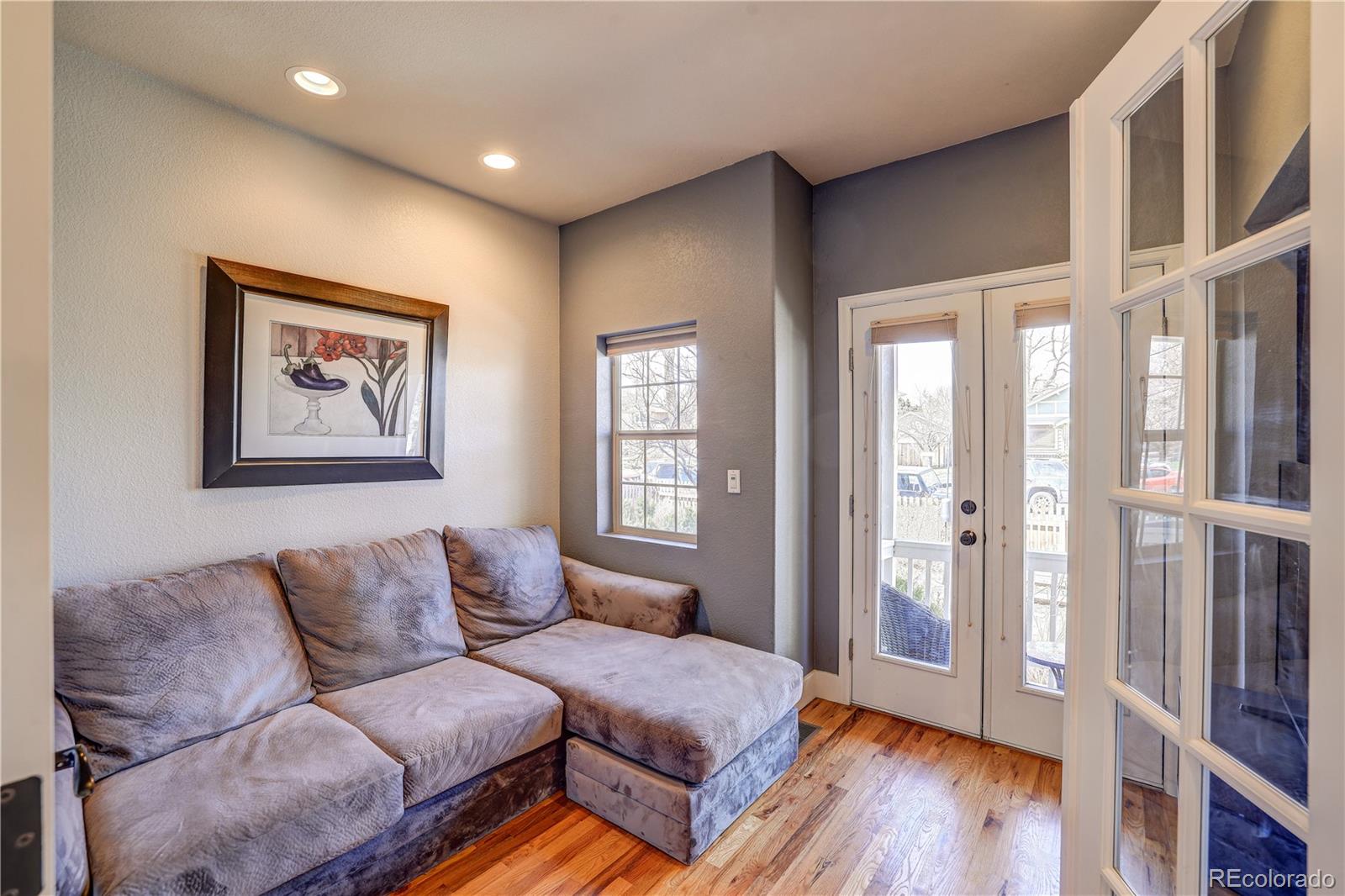 4530 Quitman Street Denver, CO 80212 - Photo 18 of 40 a living room with furniture and wooden floor