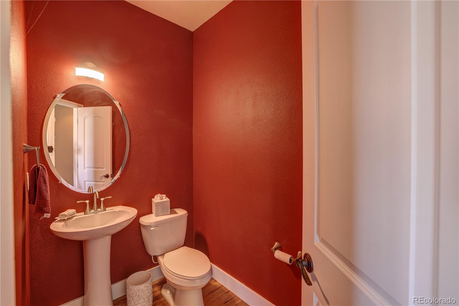 4530 Quitman Street Denver, CO 80212 - Photo 19 of 40 a bathroom with a toilet sink and mirror