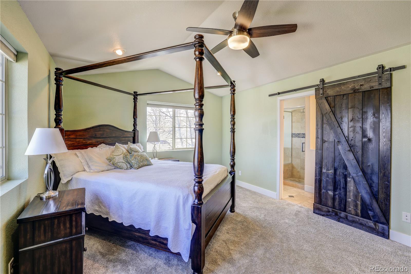 4530 Quitman Street Denver, CO 80212 - Photo 21 of 40 a bedroom with a bed and a walk in closet