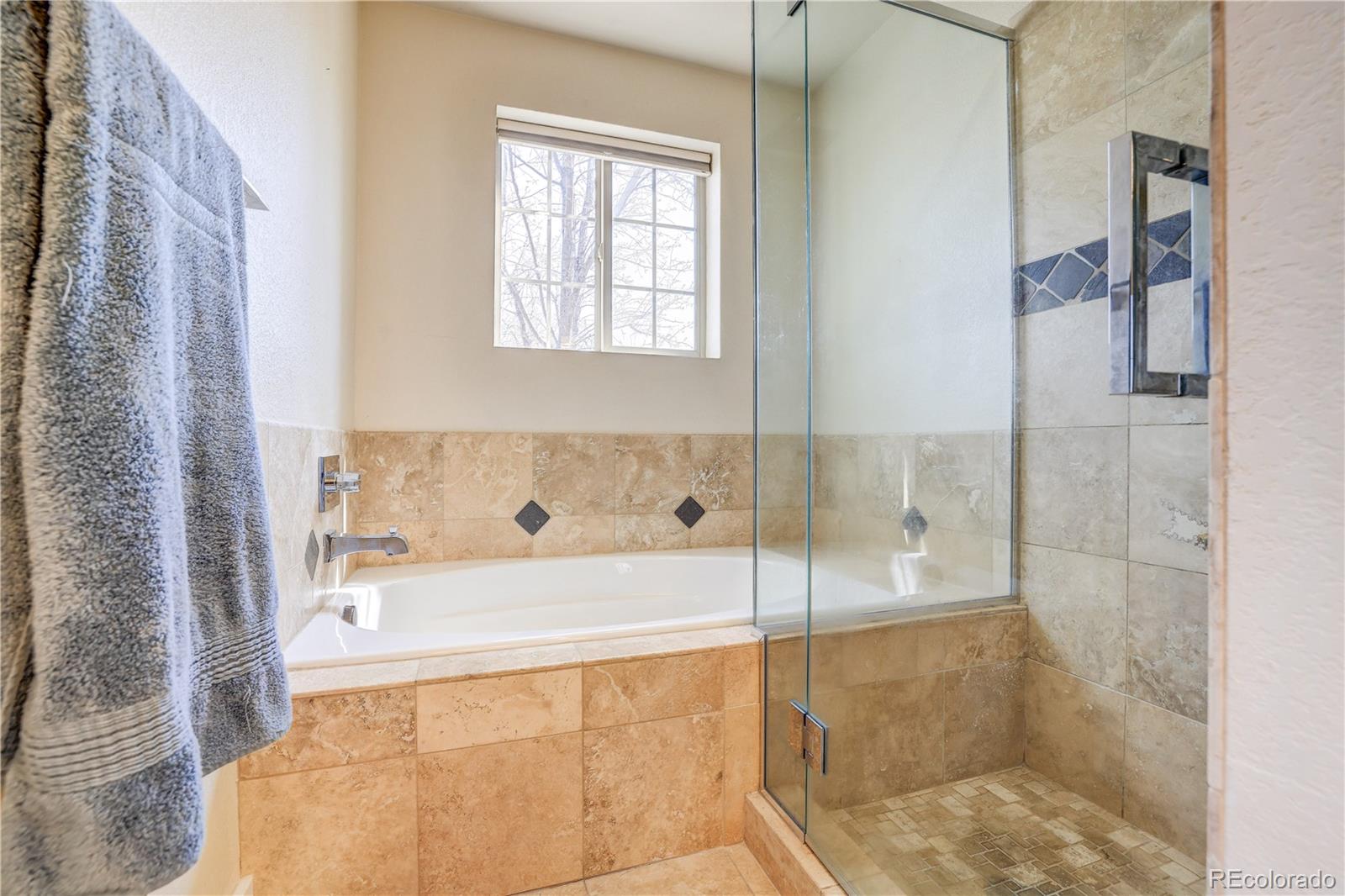 4530 Quitman Street Denver, CO 80212 - Photo 23 of 40 a bathroom with a bathtub and a shower