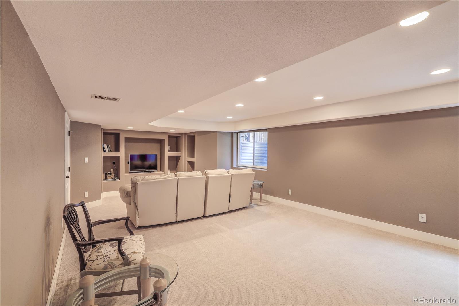 4530 Quitman Street Denver, CO 80212 - Photo 29 of 40 a living room with furniture and a table