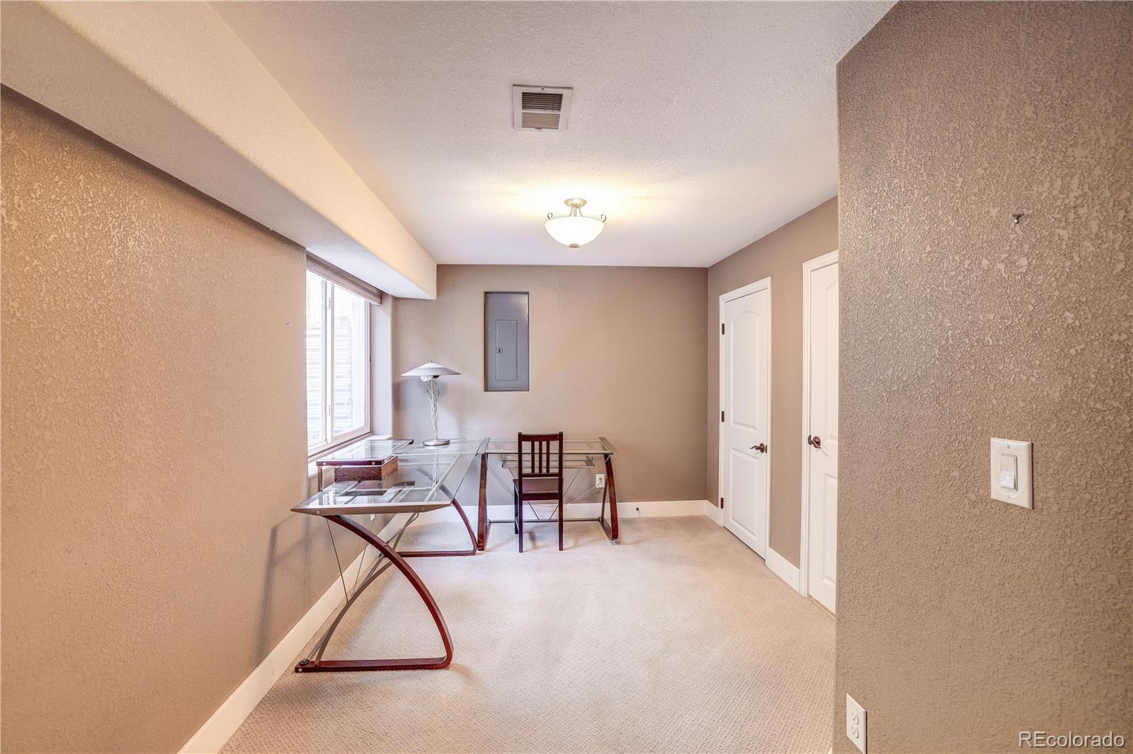 4530 Quitman Street Denver, CO 80212 - Photo 32 of 40 a view of a livingroom with furniture and white walls