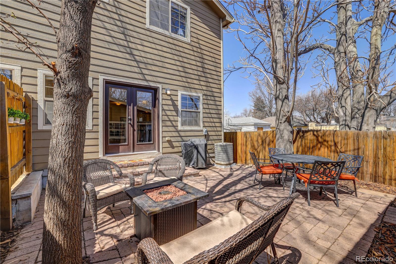 4530 Quitman Street Denver, CO 80212 - Photo 36 of 40 a view of a dinning tables and chairs in a patio